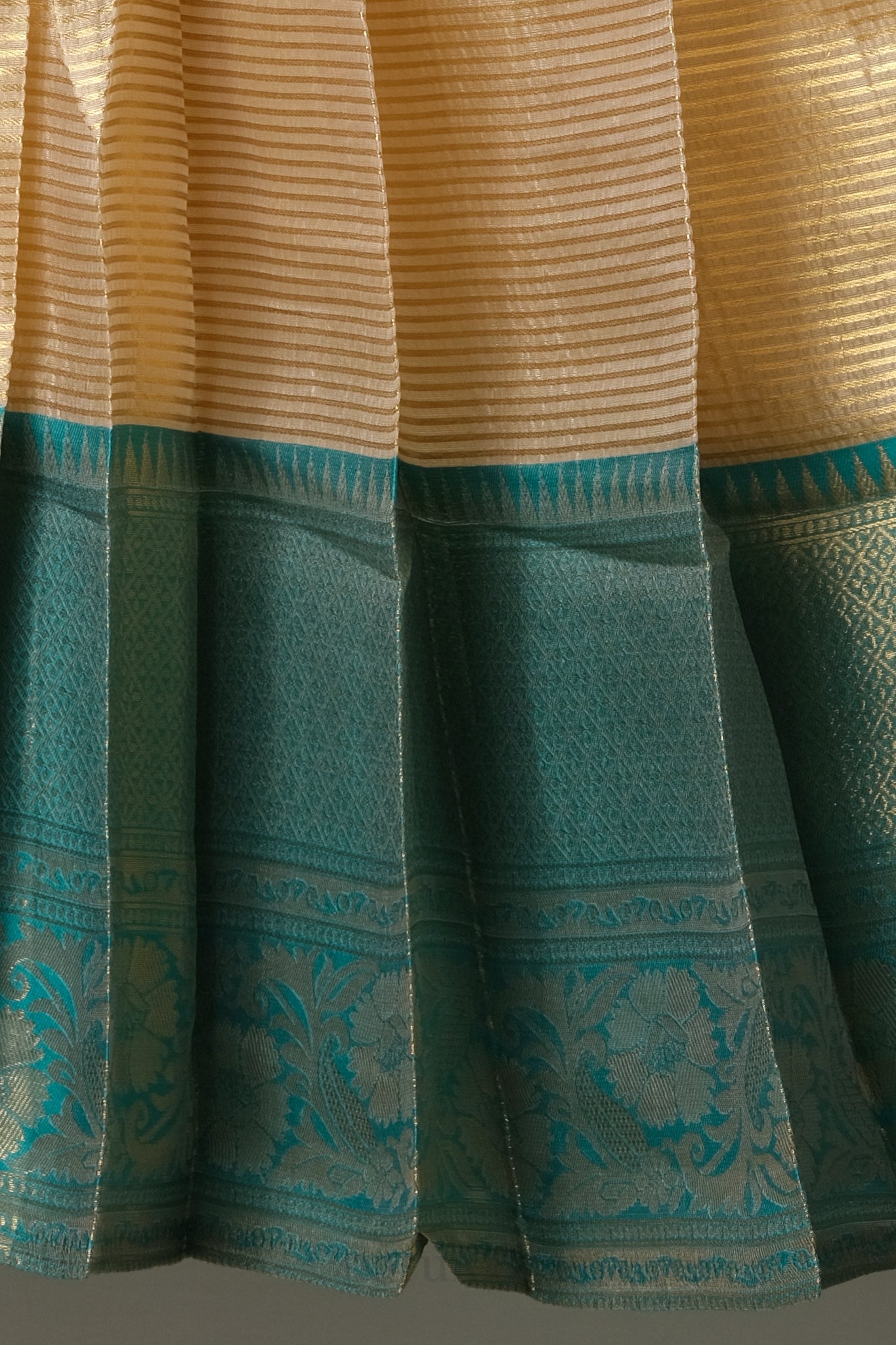 Premium Tissue Silk Dhavani Set – Champagne Gold with Striped Pattern & Rich Emerald Green Zari Border