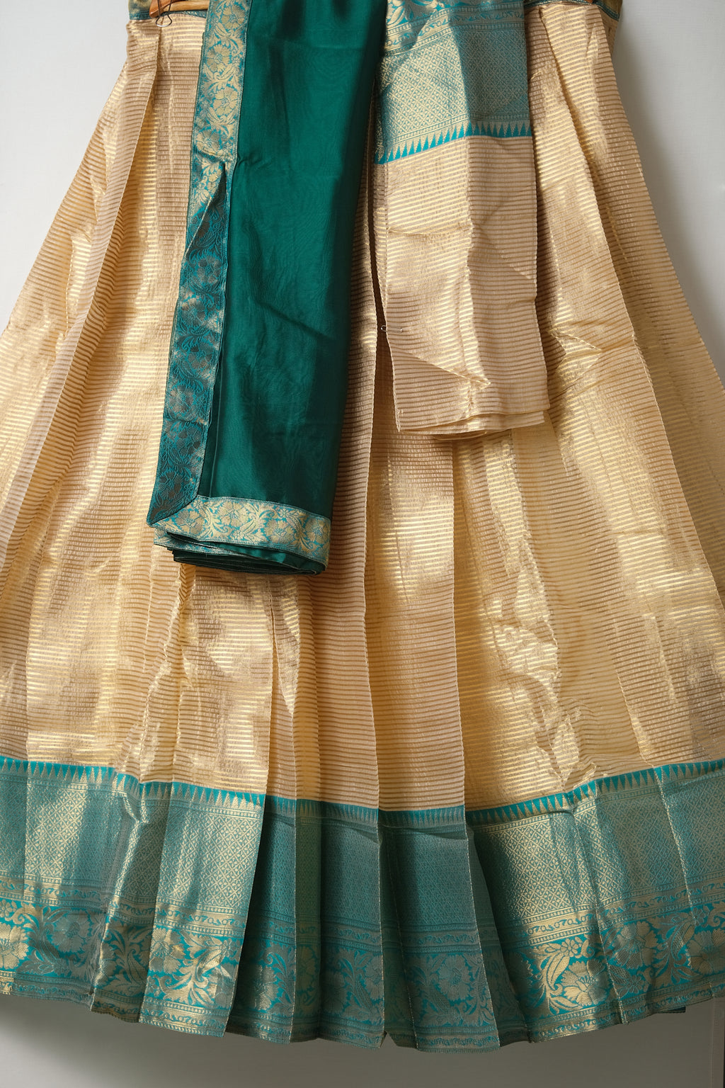 Premium Tissue Silk Dhavani Set – Champagne Gold with Striped Pattern & Rich Emerald Green Zari Border