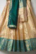 Premium Tissue Silk Dhavani Set – Champagne Gold with Striped Pattern & Rich Emerald Green Zari Border